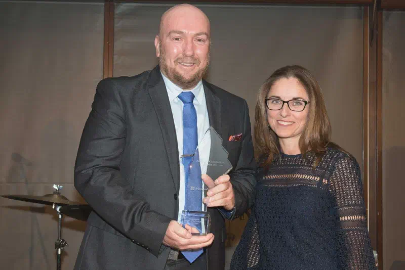 The-Best-Australian-Education-Awards Carolyn and Paul McDermott standing side by side, Paul holding award