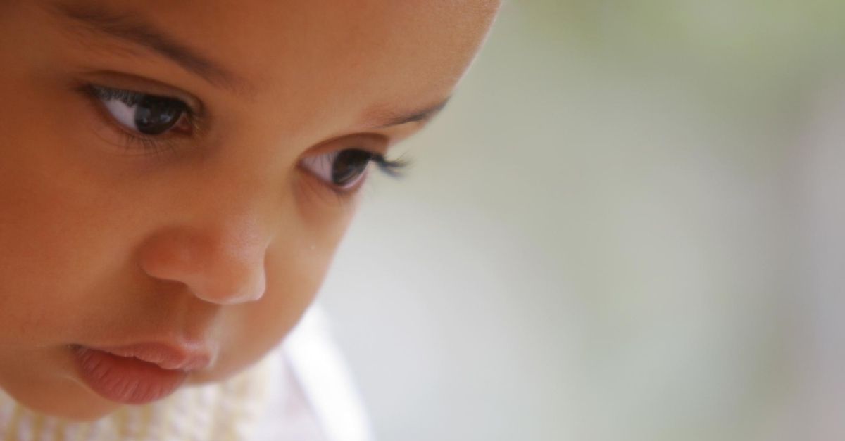 Close up of young child's face concentrating