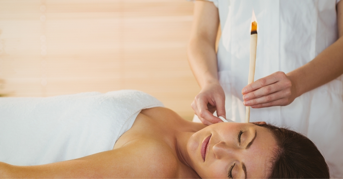 Woman having her ear candled